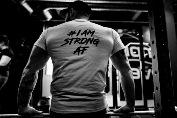 Man wearing I am strong AF t shirt