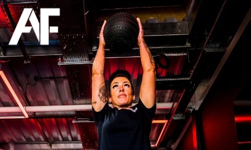 Woman performing slam ball throws